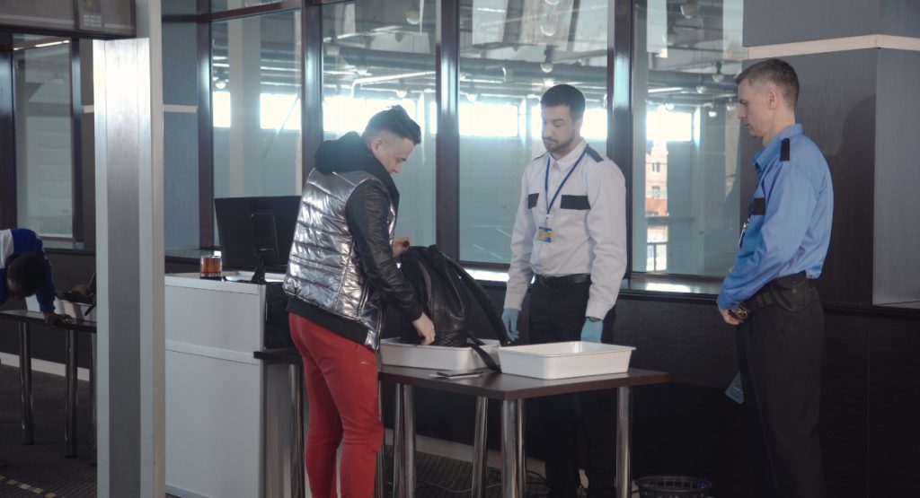 security guard checking bag